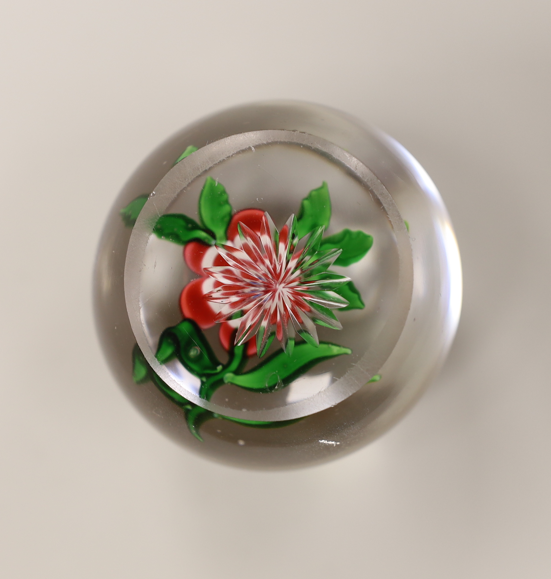 A Baccarat primrose paperweight, approximately 5cm diameter